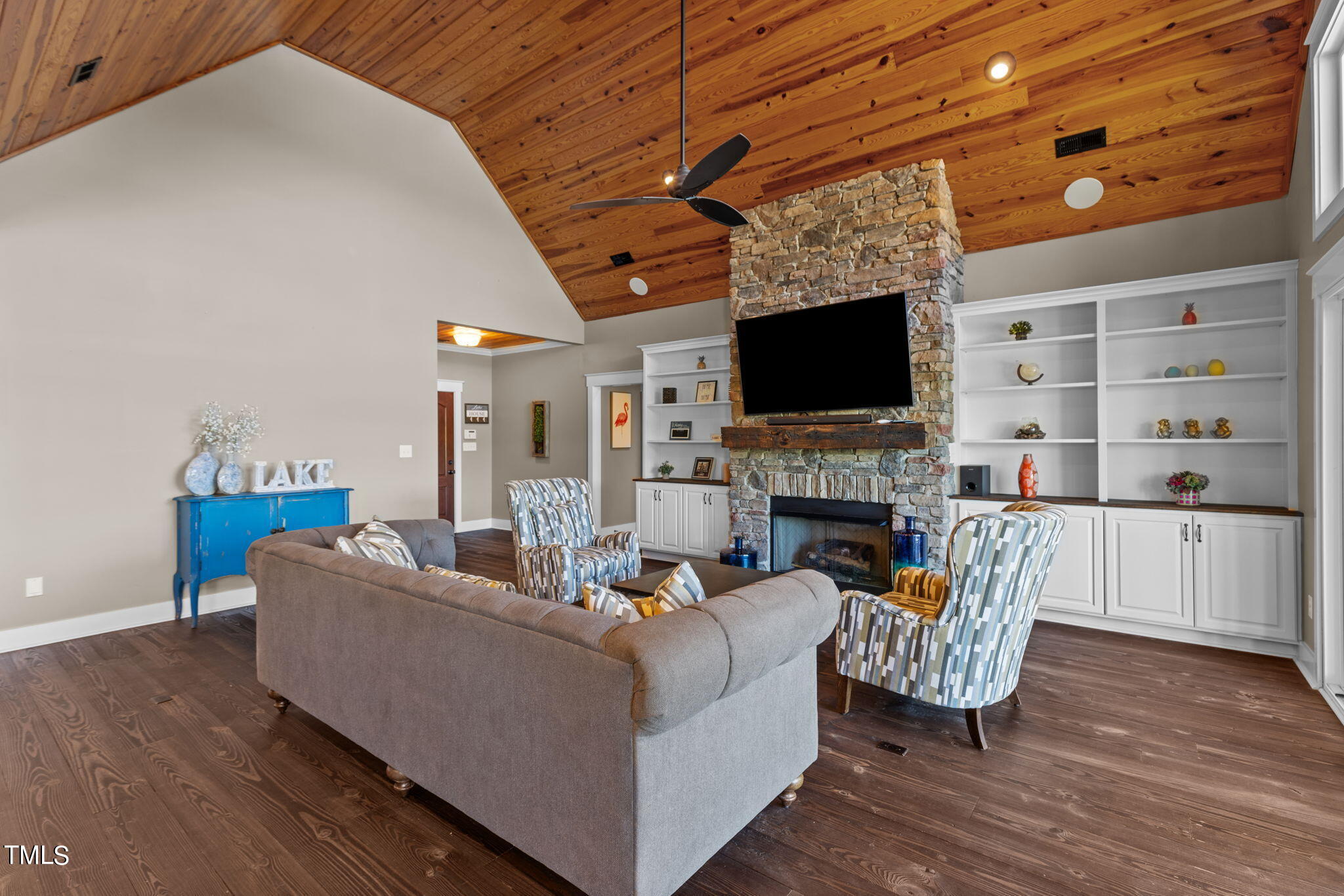 186 Polaris Point Semora, NC 27343 - Photo 12 of 73 a living room with furniture a fireplace and a flat screen tv