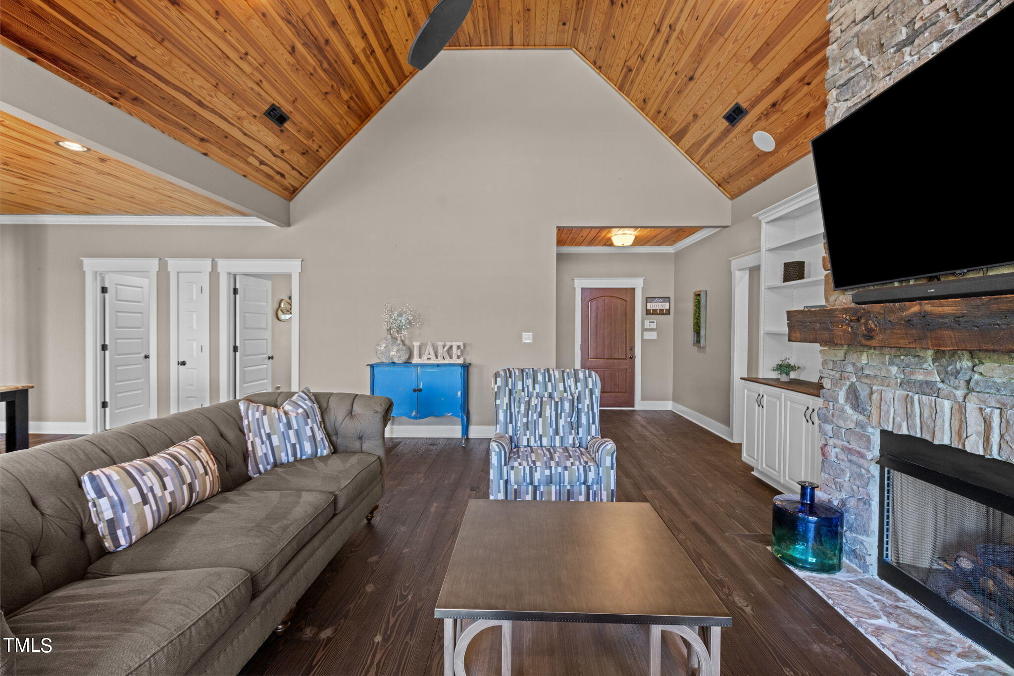 186 Polaris Point Semora, NC 27343 - Photo 13 of 73 a living room with furniture and a flat screen tv