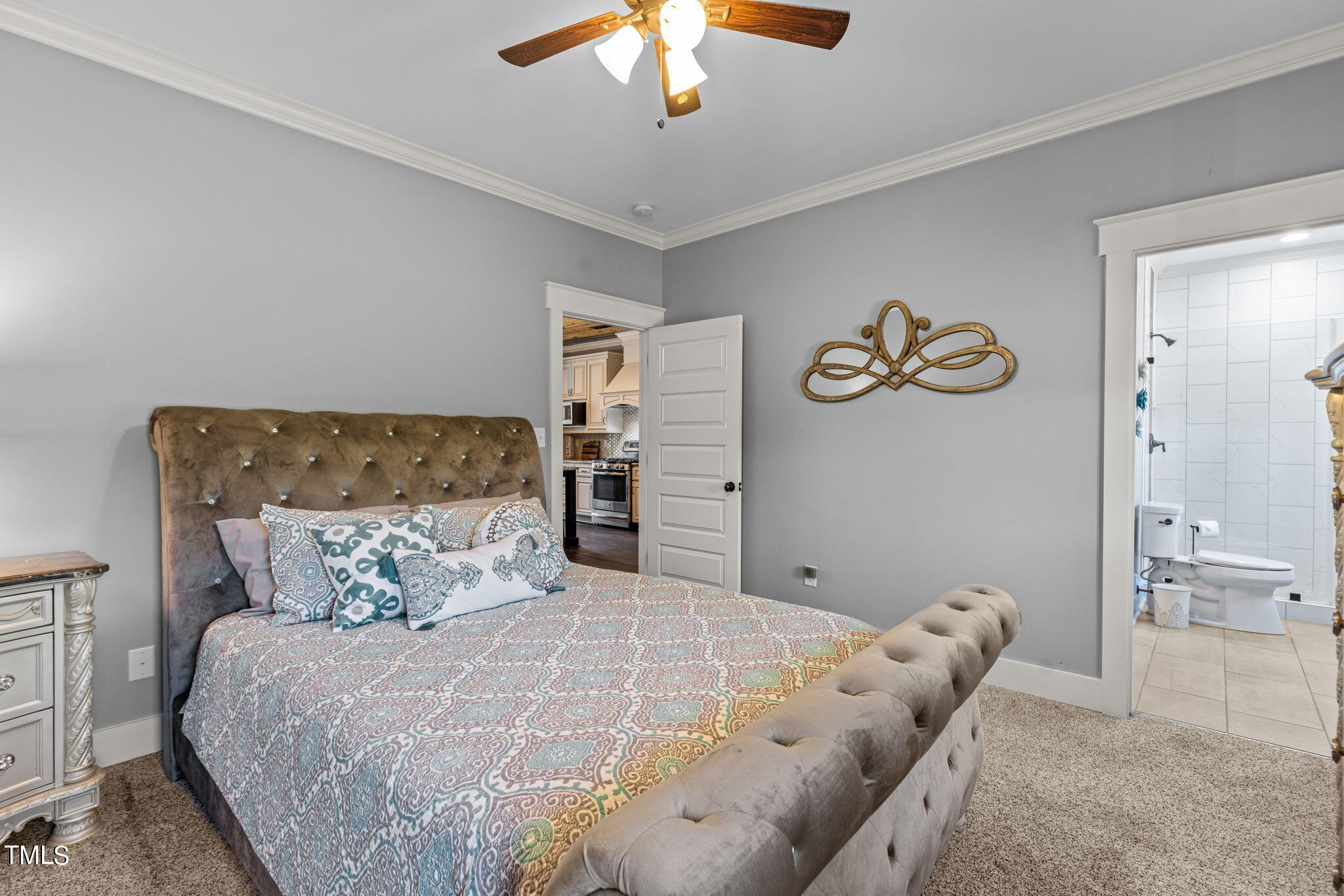 186 Polaris Point Semora, NC 27343 - Photo 33 of 73 a bedroom with a large bed and a chandelier