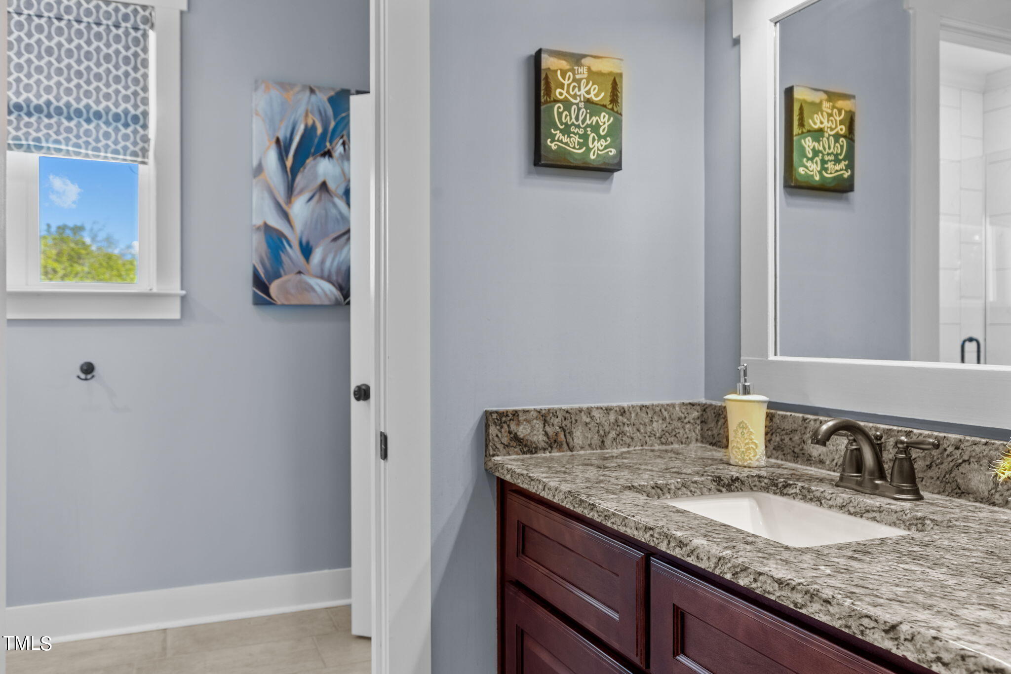 186 Polaris Point Semora, NC 27343 - Photo 34 of 73 a bathroom with a granite countertop sink and a mirror