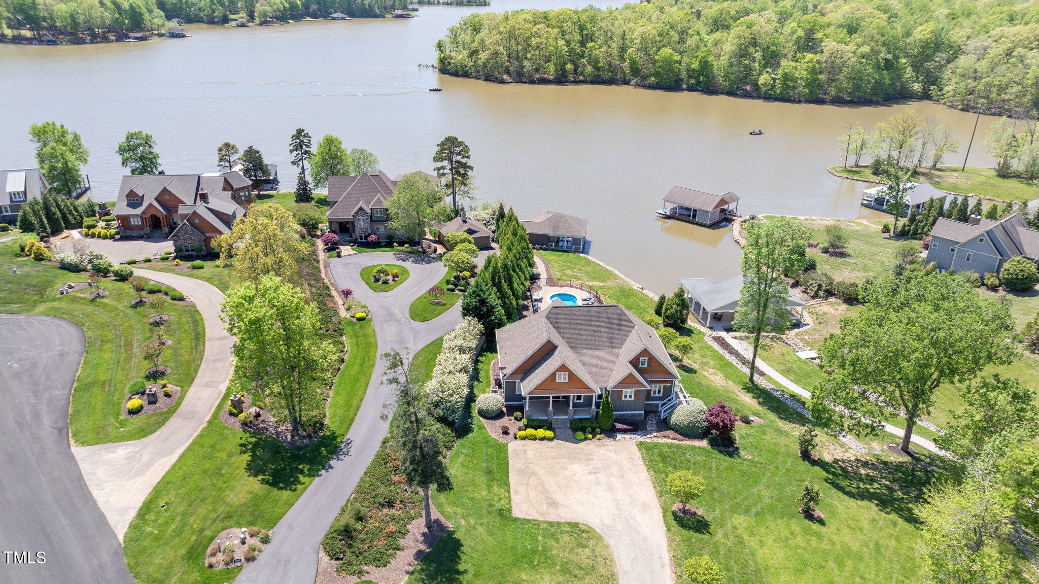 186 Polaris Point Semora, NC 27343 - Photo 62 of 73 an aerial view of a house with a yard and lake view