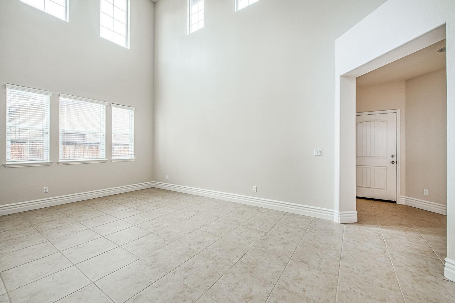 3036 Portals Avenue Clovis, CA 93619 - Photo 11 of 53 an empty room with windows