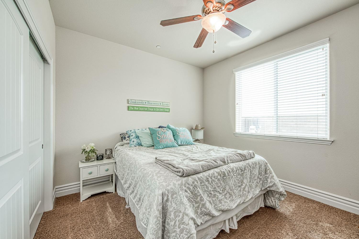 3036 Portals Avenue Clovis, CA 93619 - Photo 15 of 53 a bedroom with a bed and a window