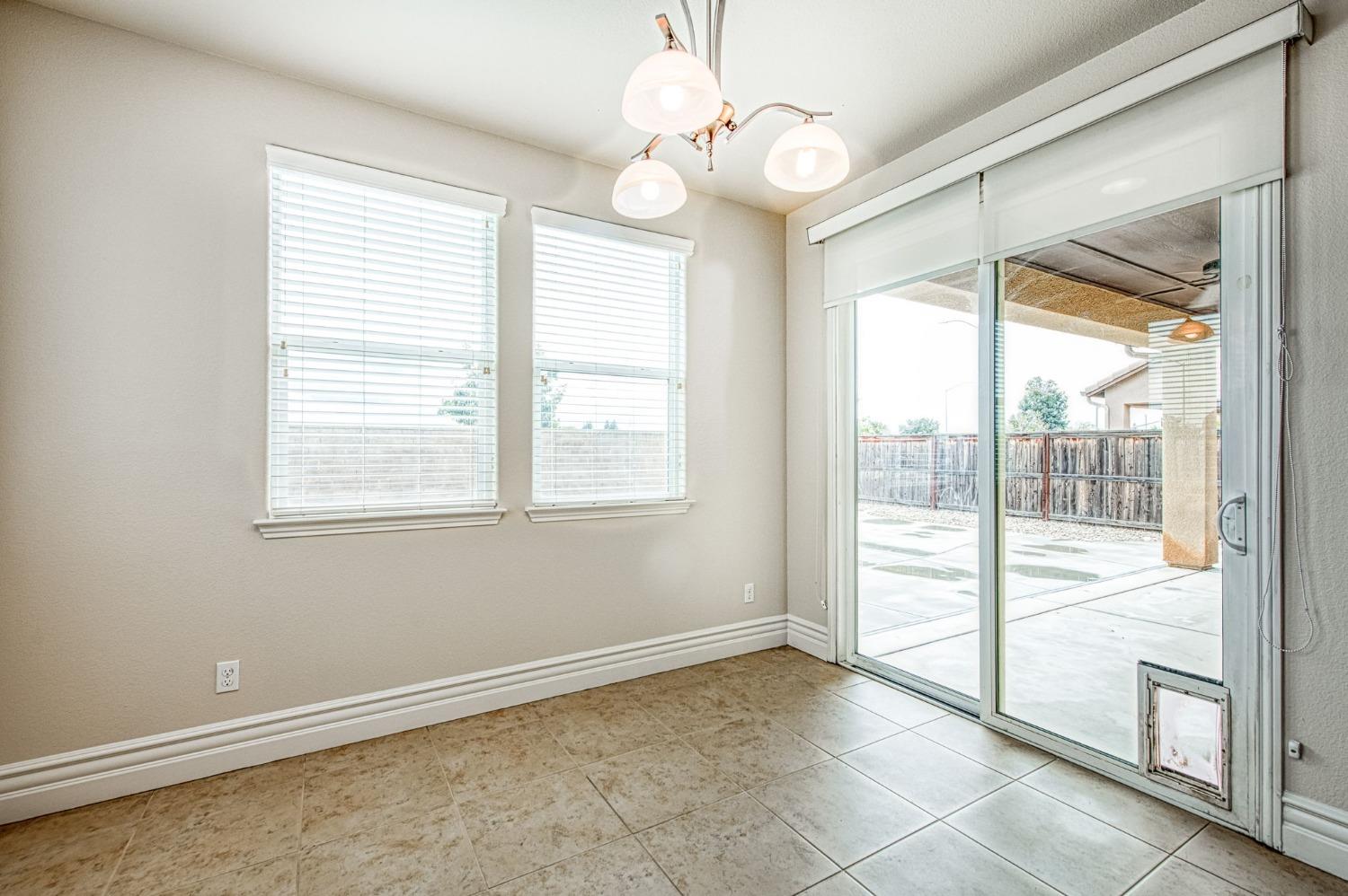 3036 Portals Avenue Clovis, CA 93619 - Photo 25 of 53 a view of an empty room with a window