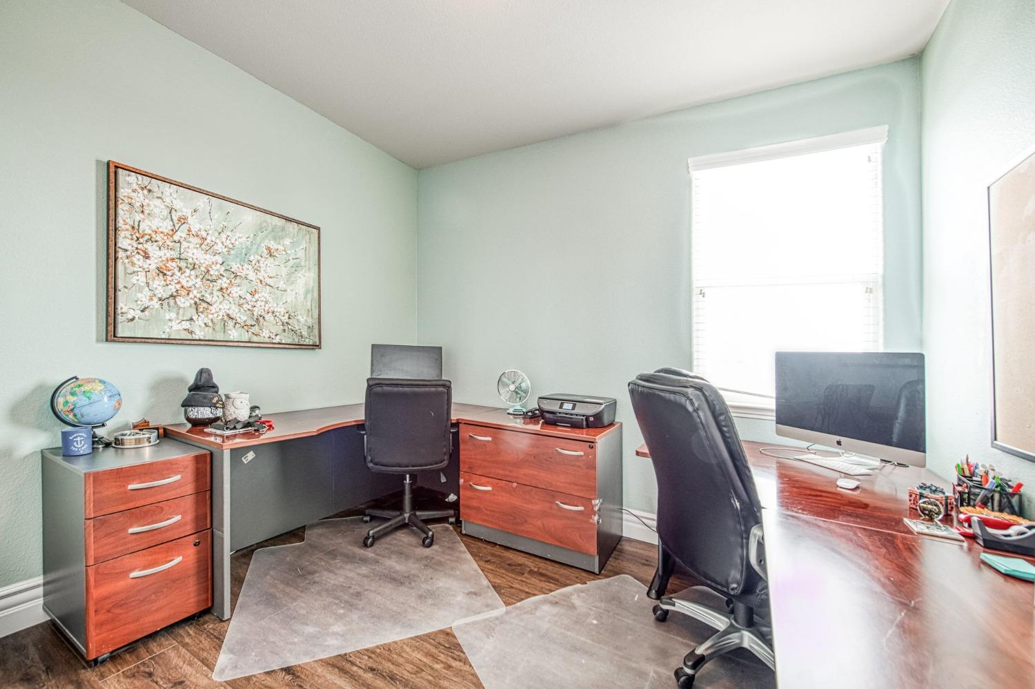 3036 Portals Avenue Clovis, CA 93619 - Photo 33 of 53 a view of a workspace with furniture and a window