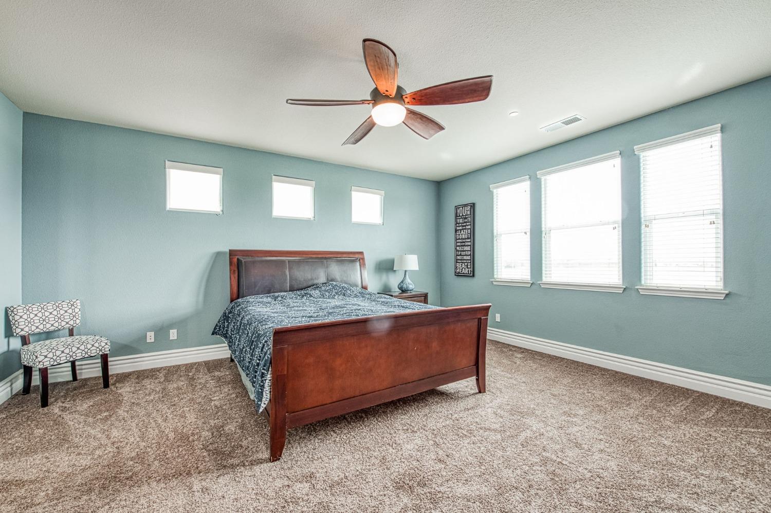 3036 Portals Avenue Clovis, CA 93619 - Photo 36 of 53 a bed room with a bed and a window