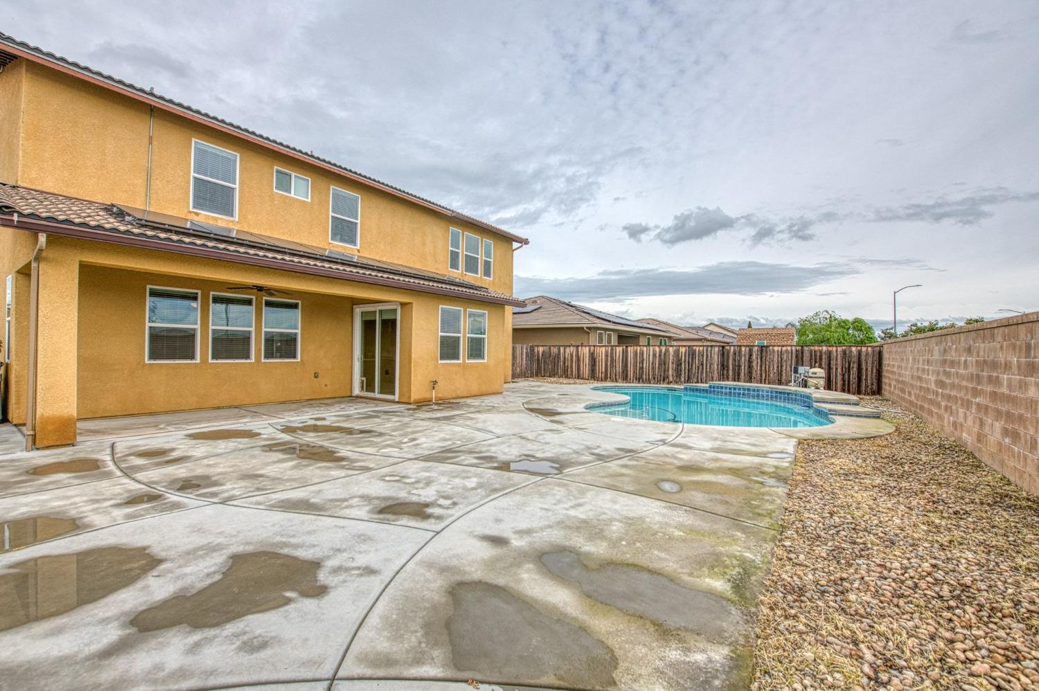 3036 Portals Avenue Clovis, CA 93619 - Photo 44 of 53 a view of a house with a backyard