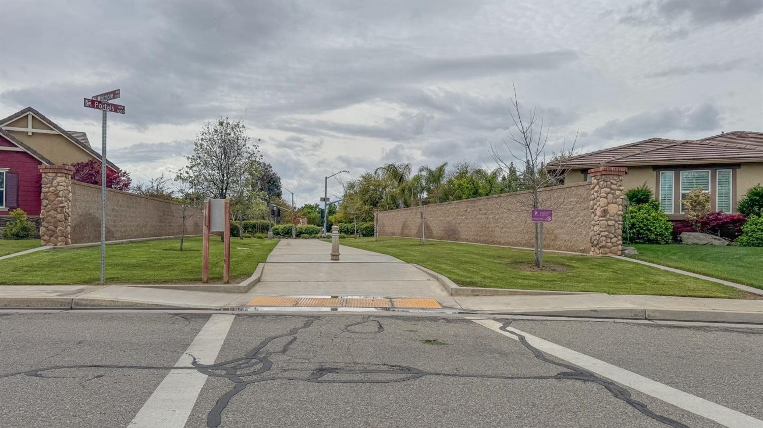 3036 Portals Avenue Clovis, CA 93619 - Photo 53 of 53 a view of street with a small yard and a car parked