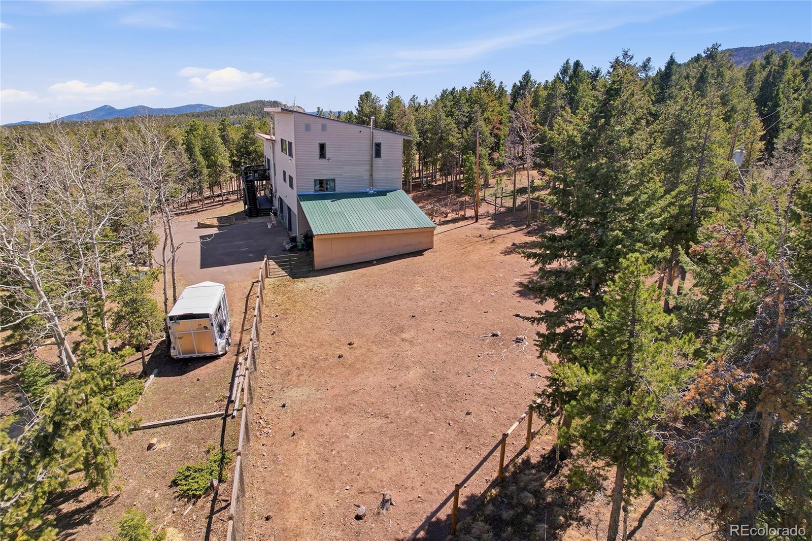 9225 Sandy Lane Conifer, CO 80433 - Photo 37 of 45 an aerial view of a house with a yard