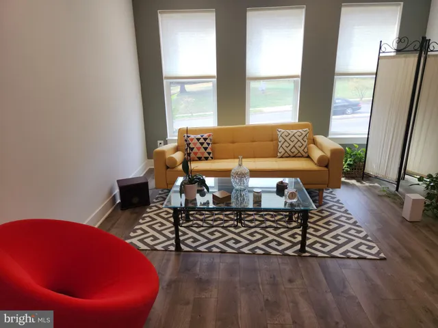 a living room with a couch and a table