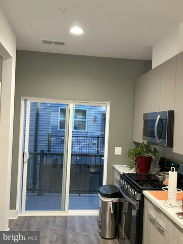 a kitchen with a stove and a refrigerator