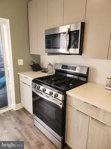 a kitchen with a stove and a microwave