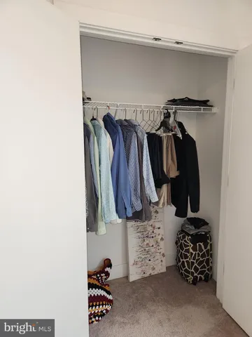 a bedroom with a bed and a tv