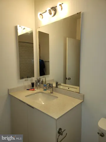 a bathroom with a toilet a sink and shower