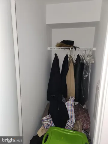 a close view of shoes stand and a utility room