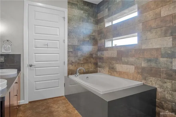 a bathroom with a sink a toilet a shower and a bathtub