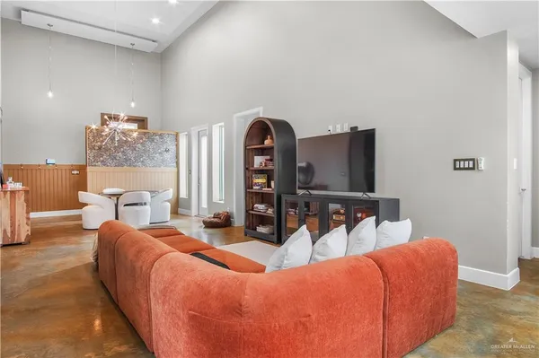 a living room with furniture and a lamp