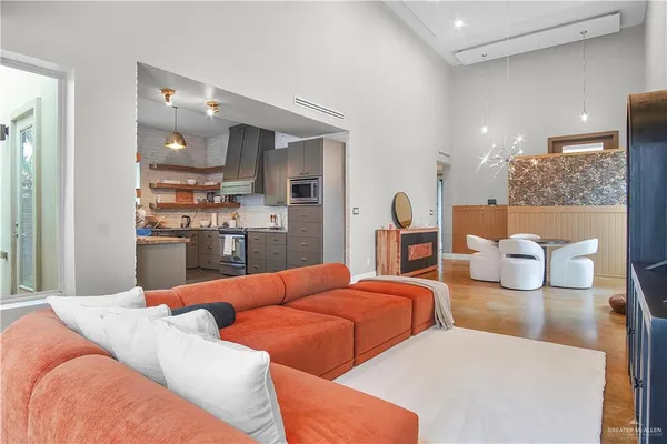 a bedroom with two beds and painting on the wall