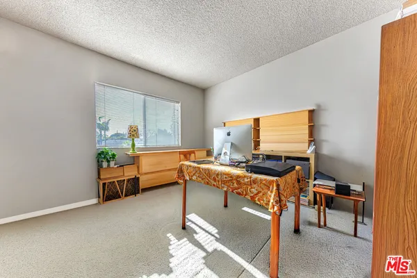 a work room with furniture and window