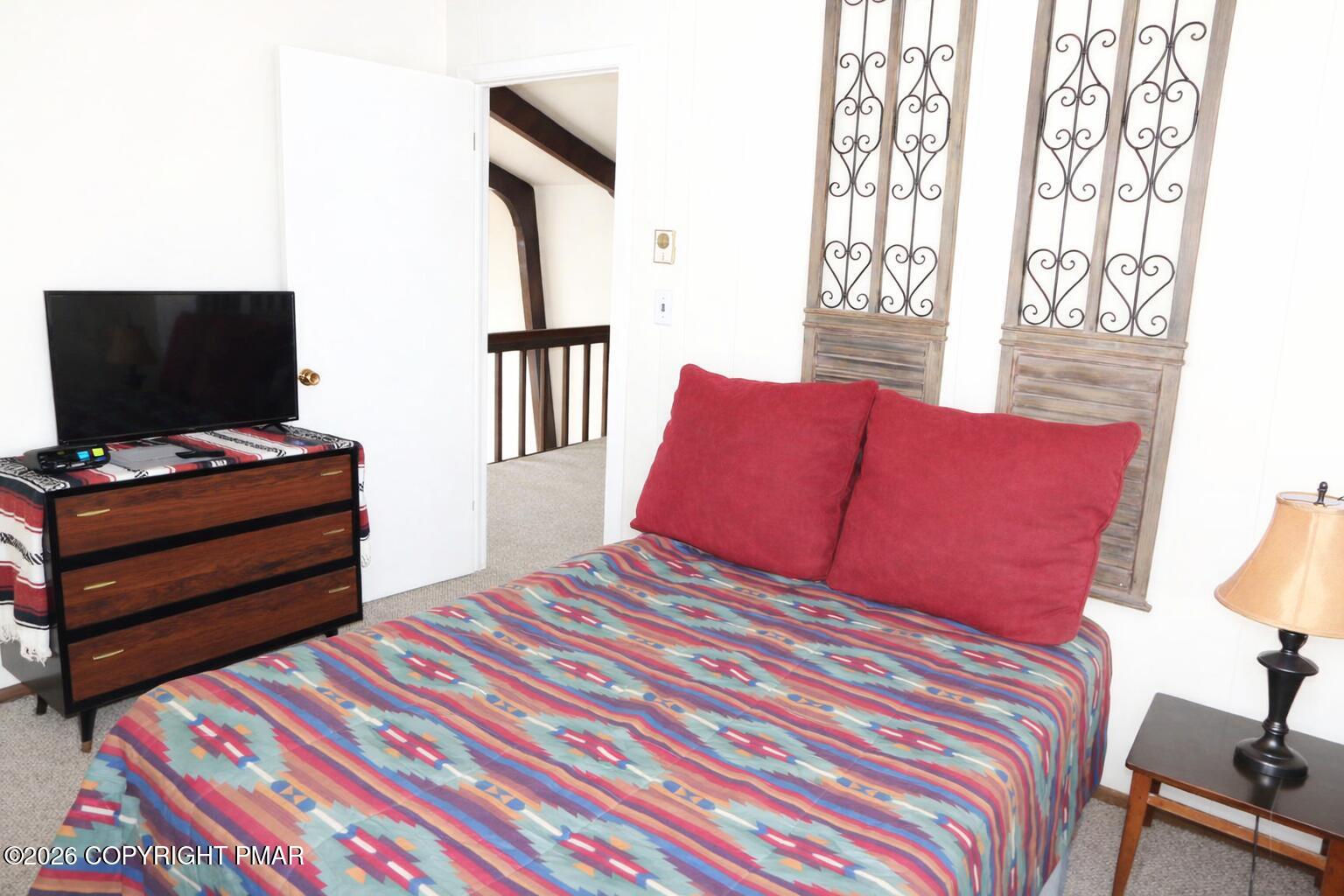 1635 Ridgeview Drive Lake Ariel, PA 18436 - Photo 14 of 16 a bedroom with a bed and a flat screen tv