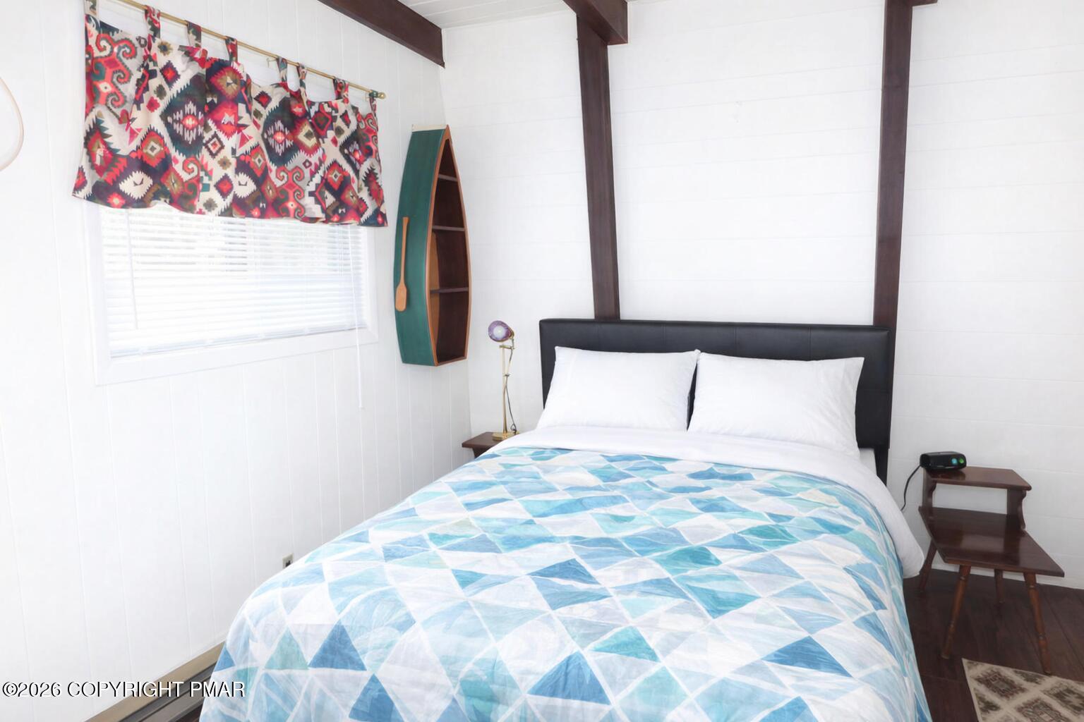 1635 Ridgeview Drive Lake Ariel, PA 18436 - Photo 15 of 16 a large bed sitting in a bedroom next to a small yard