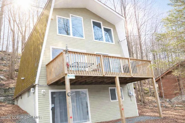 a room with furniture a refrigerator and a sink