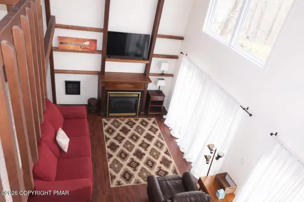 a bathroom with a granite countertop sink a mirror and a window