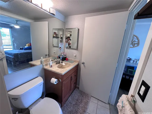 a view of living room with furniture and a mirror