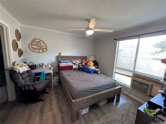 a bedroom with furniture and a window