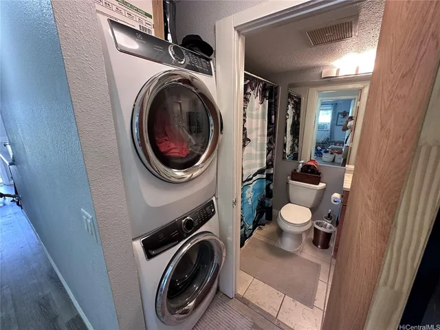 a view of a hallway with washer and dryer