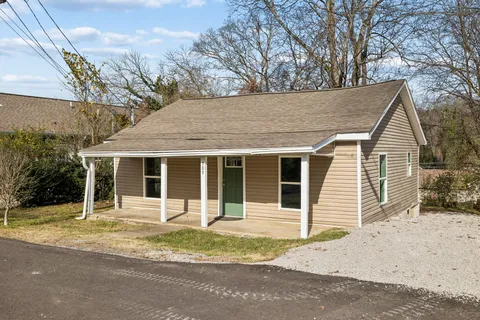 a house with trees in the background