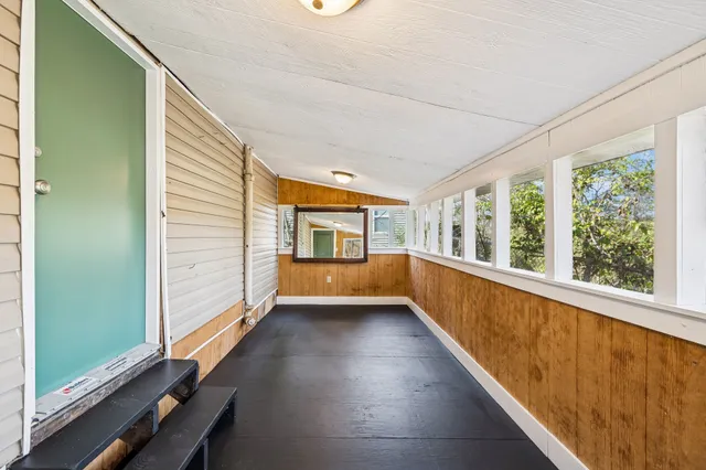 a view of balcony with wooden floor