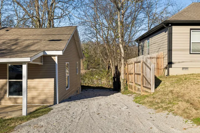 a view of a house with a snow in the yard