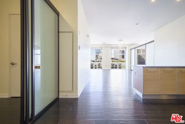 a view of a living room with wooden floor