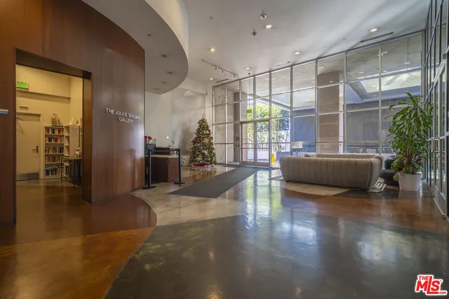 a living room with furniture window and wooden floor