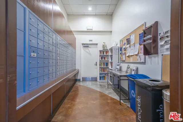 a bathroom with double vanity sinks a vanity and a large mirror