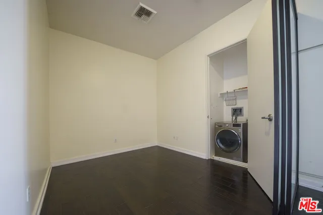 a view of a storage & utility room with a sink
