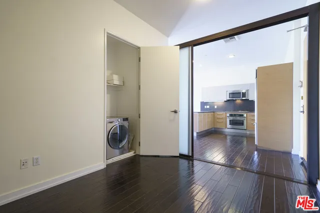 a view of a hallway and wooden floor