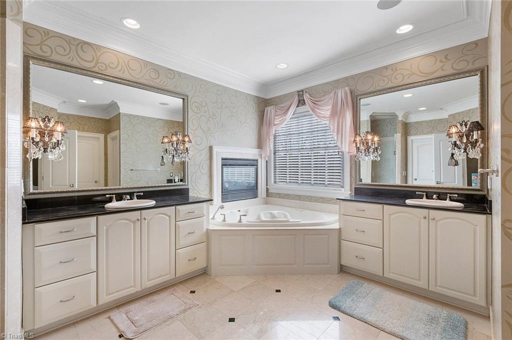 4237 Rock Bridge Road High Point, NC 27262 - Photo 18 of 30 Master bath with double vanities, jetted tub, separate shower and two walk-in closets.