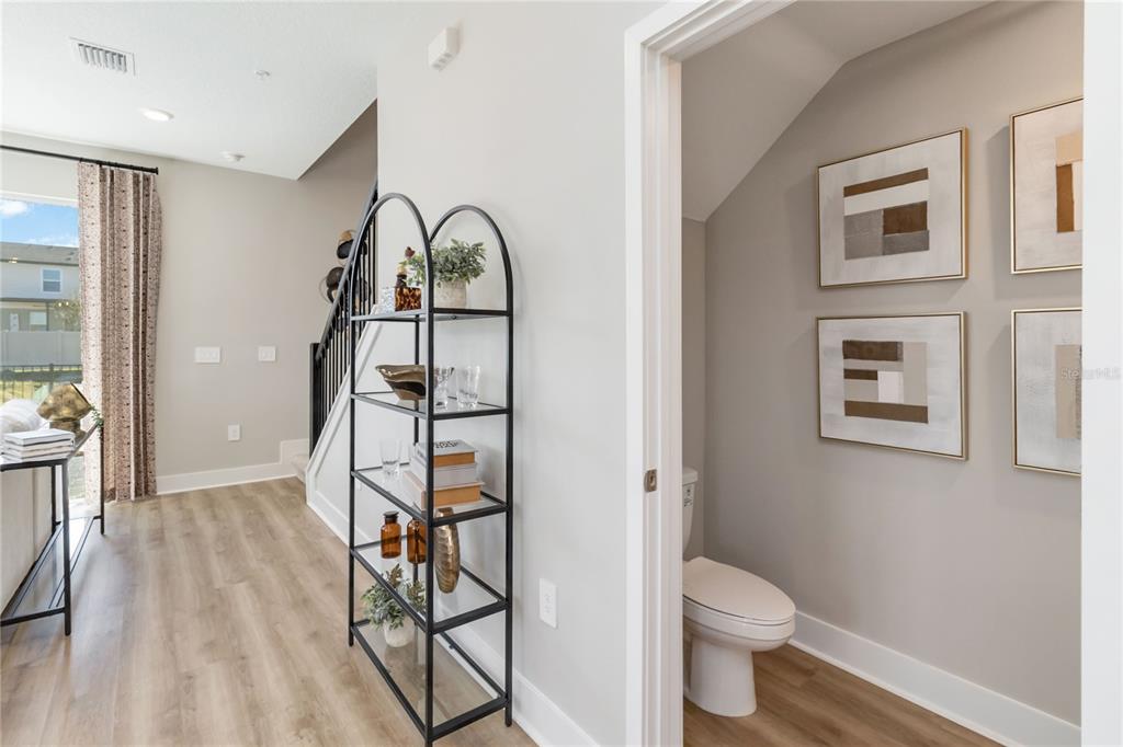 1077 Orange Trailside Way Ocoee, FL 34761 - Photo 14 of 30 a bathroom with a toilet a sink and a mirror