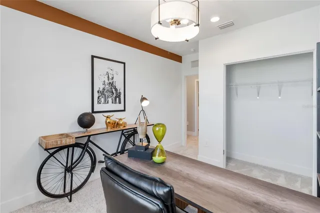 a view of dining room with furniture and wooden floor