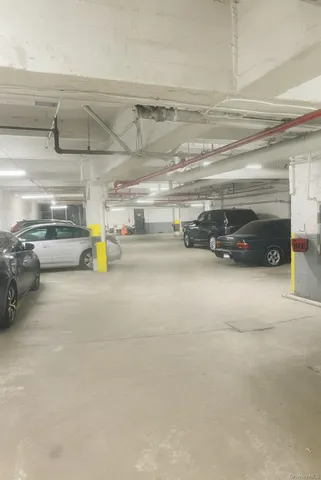 a view of parking garage with cars