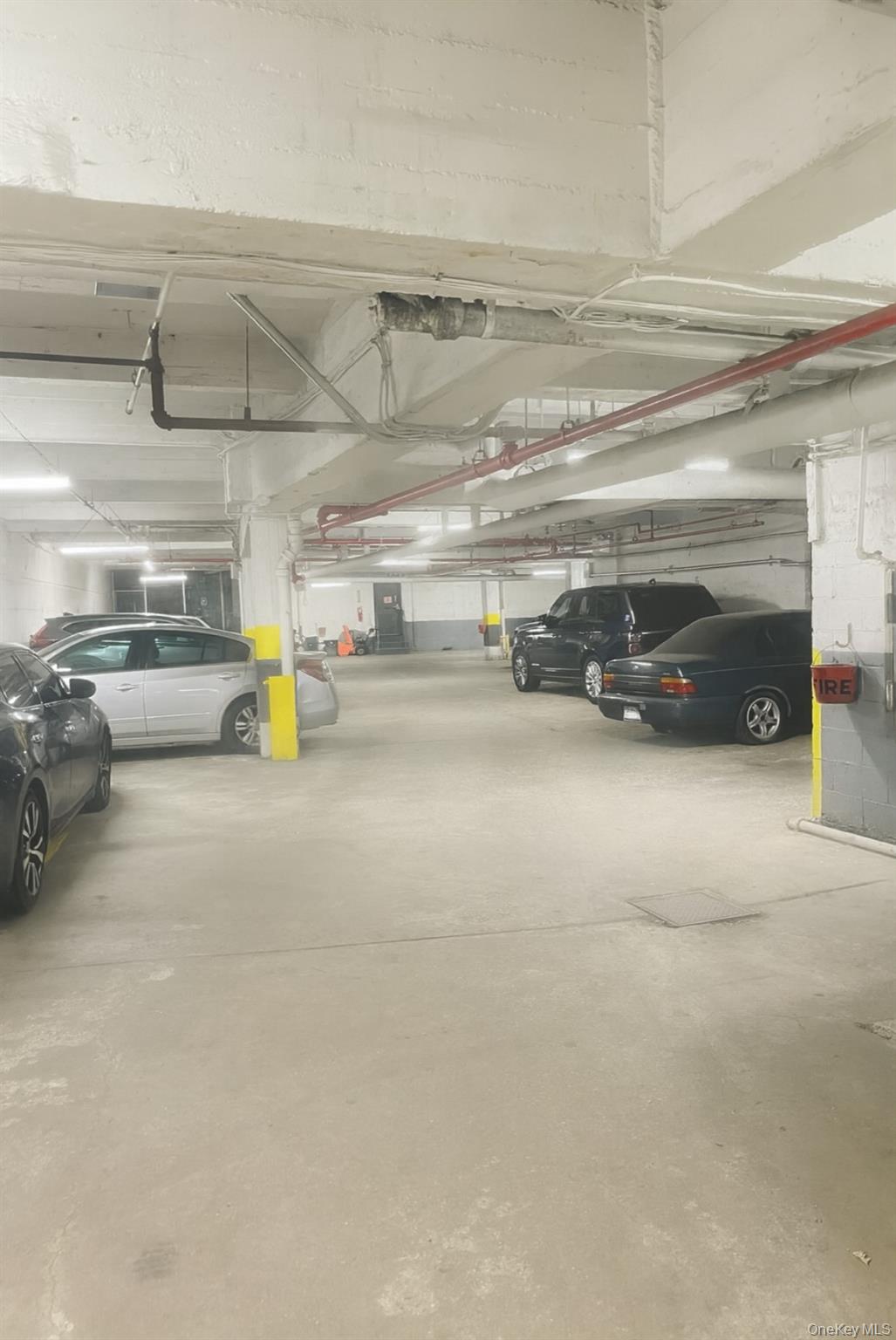 86-04 Grand Avenue, Unit 2D Queens, NY 11373 - Photo 12 of 13 a view of parking garage with cars