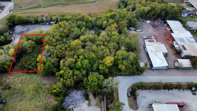 an aerial view of residential house with outdoor space and swimming pool