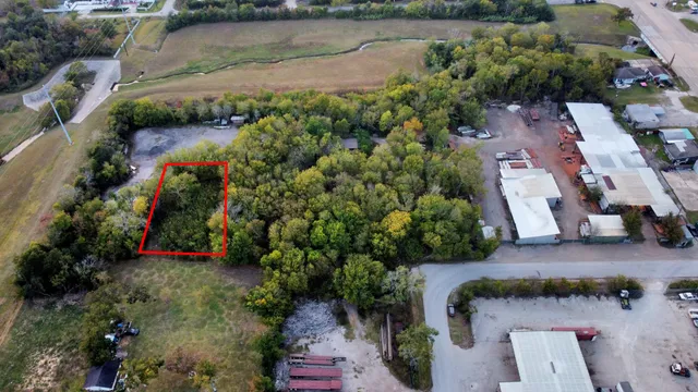 an aerial view of a house with a lake view