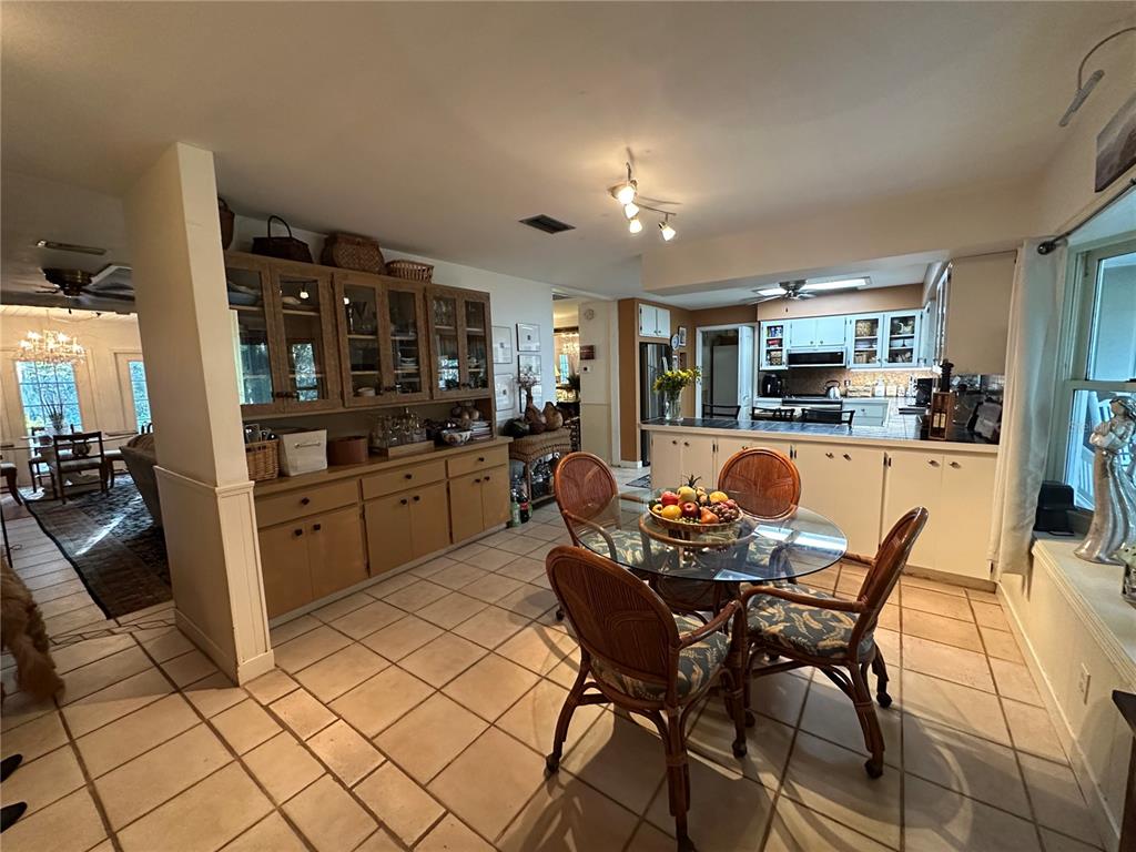 24392 Lanark Road Brooksville, FL 34601 - Photo 41 of 58 a kitchen with stainless steel appliances kitchen island granite countertop a sink and cabinets