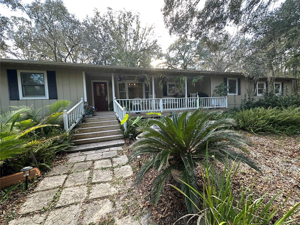 24392 Lanark Road Brooksville, FL 34601 - Photo 45 of 58 a view of a house with patio