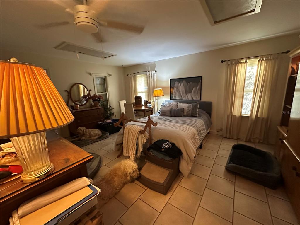 24392 Lanark Road Brooksville, FL 34601 - Photo 47 of 58 a living room with furniture and a flat screen tv