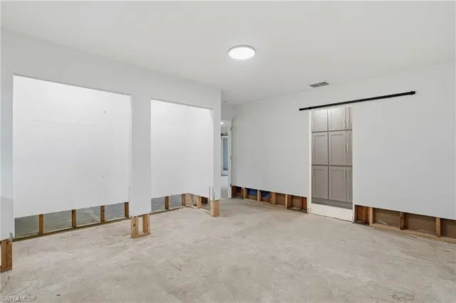 an empty room with windows