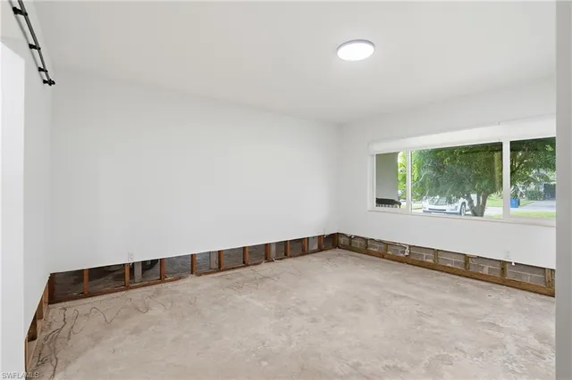 an empty room with large window